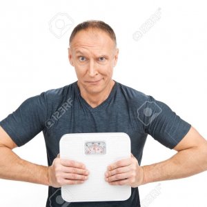 29469390-disappointed-aged-man-squeezing-scales-upset-male-holding-weight-scales-Stock-Photo.jpg